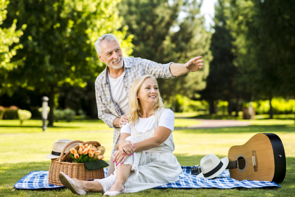Couple at park pointing